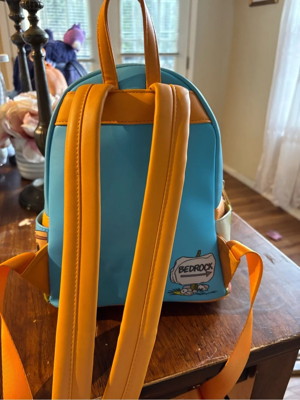 Cartoon Flintstones Loungefly Mini Backpack in Light Blue and Yellow